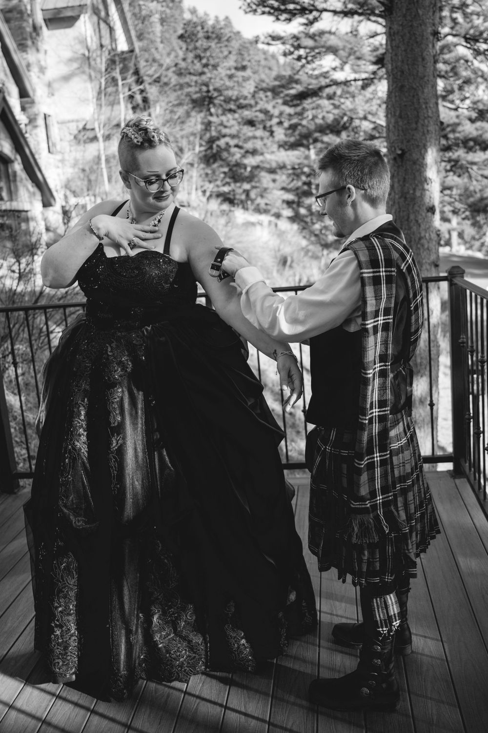 Black and white photo series showing two people in formal attire dancing and laughing together on a deck.