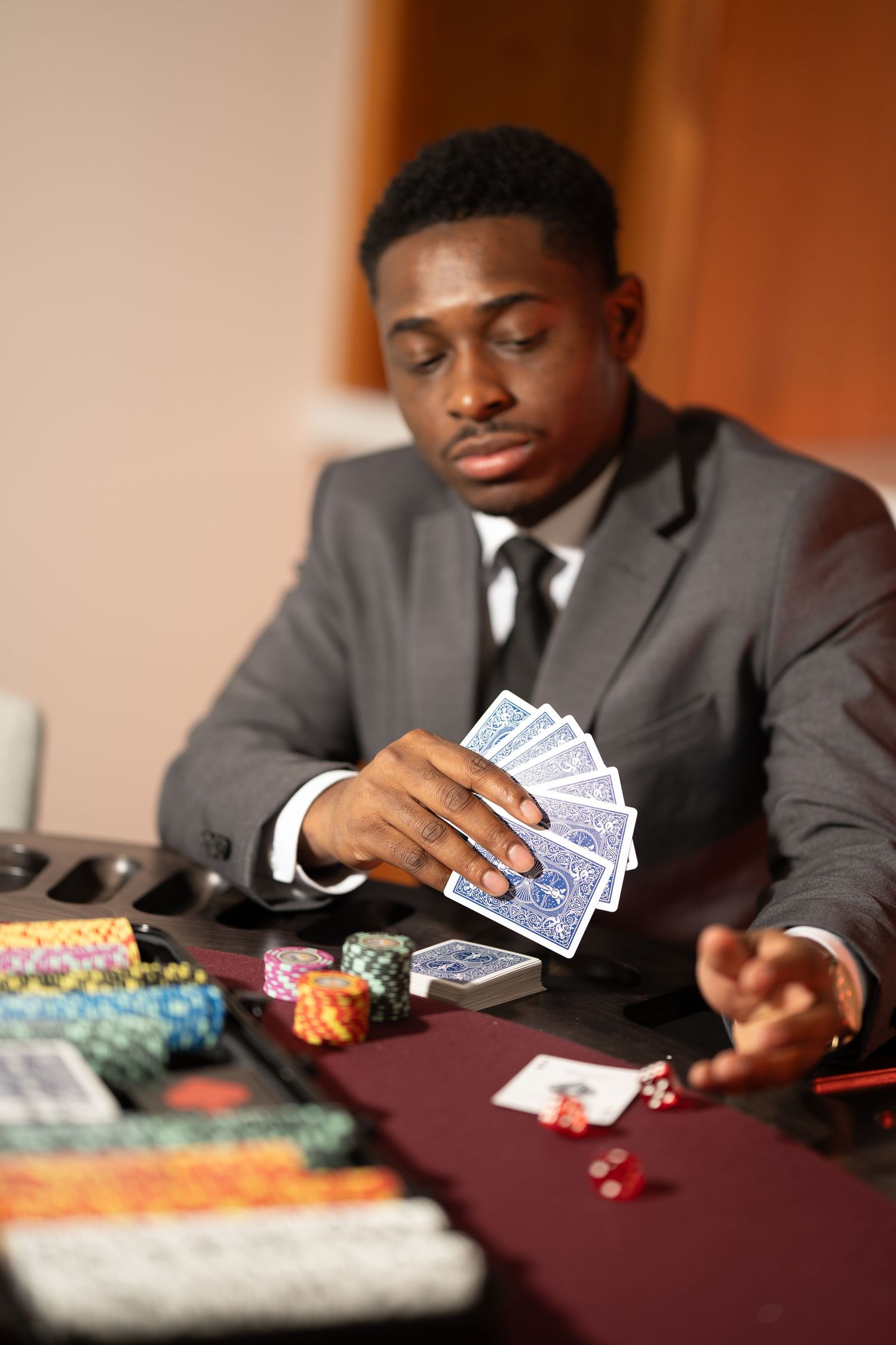 A sequence of poker game images showing hands holding cards at a table with colorful chips.