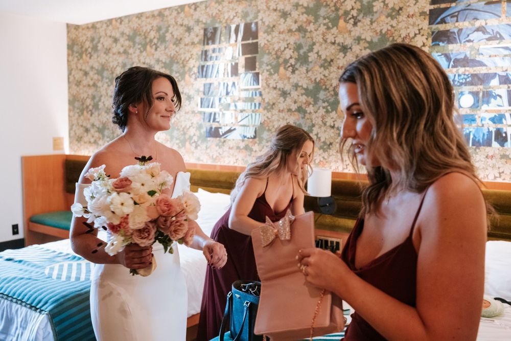 Wedding preparation scene with bridal bouquet and formal attire.