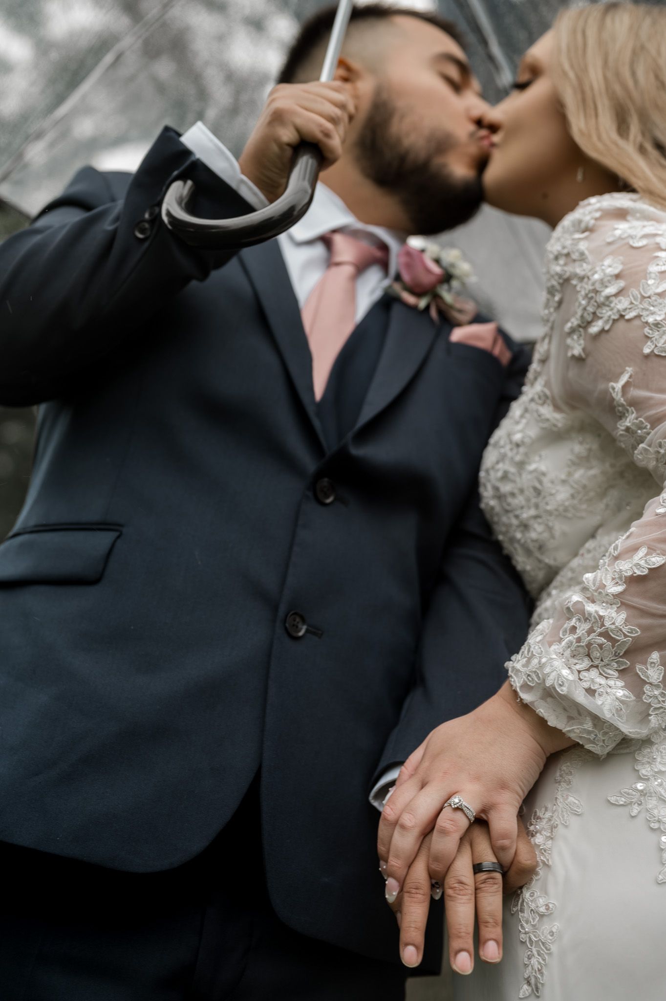 Wedding day photo, kissing under umbrella. Rainy wedding day. Pandessa Photography, Valley center wedding photo by Pandessa photography