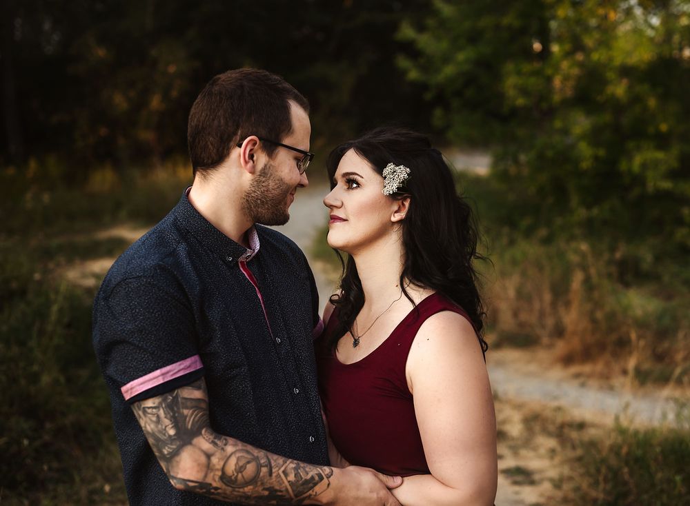 Newly engaged couple looking into each others eyes at Pearce Estate Park, Calgary, Alberta