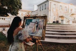 Historic white stone building with steps and columns viewed through an artist's perspective.