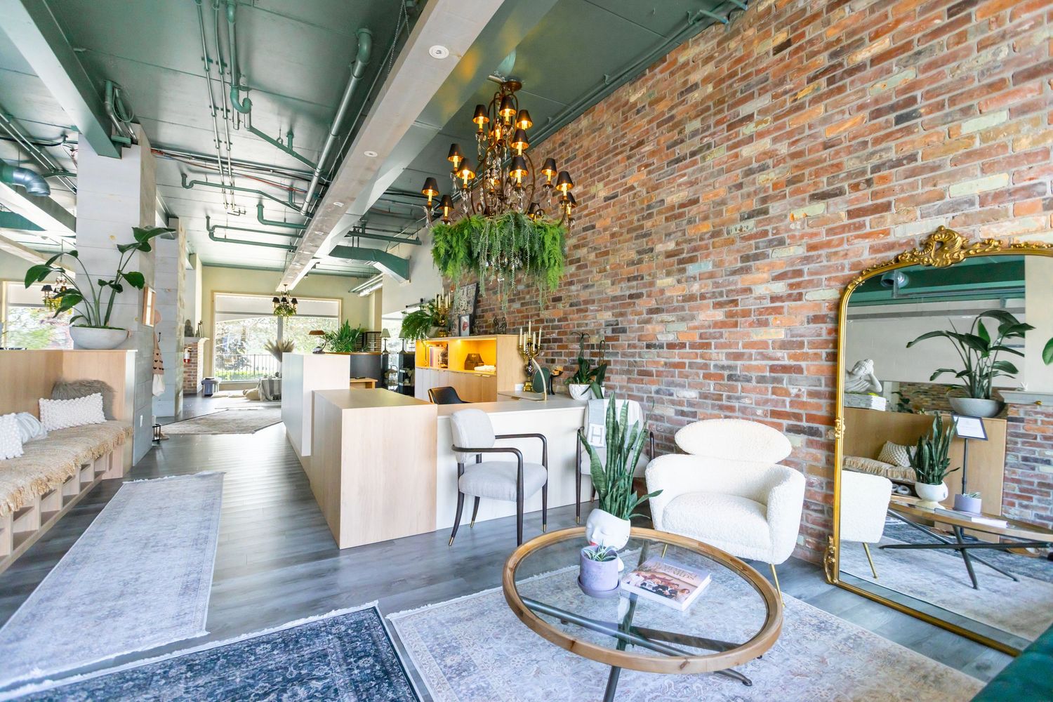Peaceful yoga practice space featuring large windows and an open floor plan.