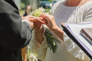Exchanging wedding rings in outdoor ceremony