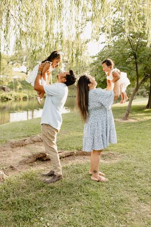 A couple dances together under willow trees in a romantic outdoor photoshoot sequence in Frederick Maryland