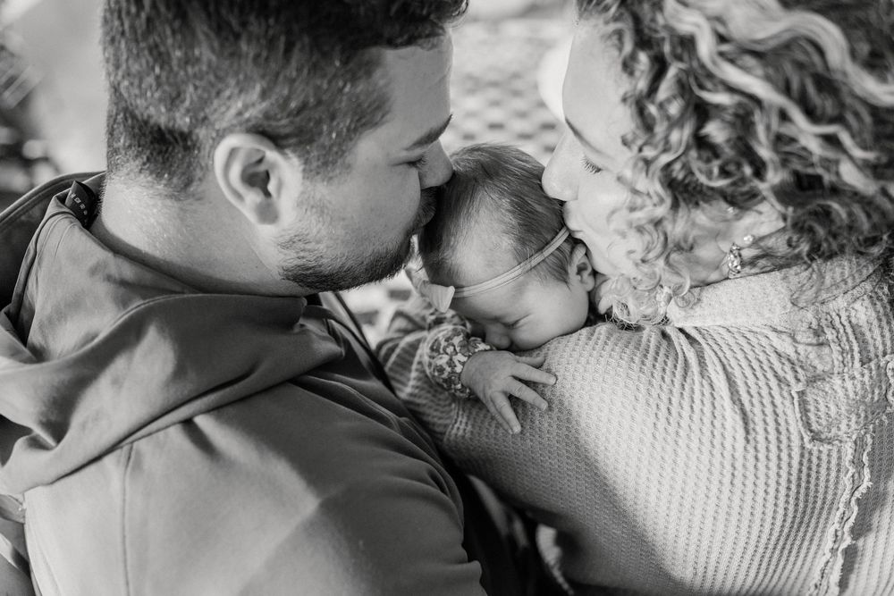 A collection of intimate black and white photographs showing tender moments between couples in romantic poses.