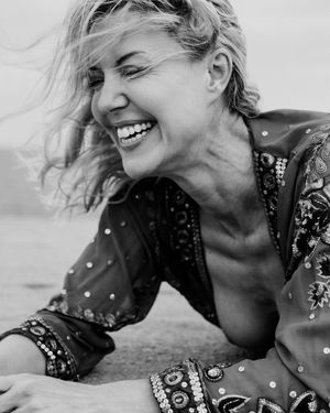 Black and white sequence of photos showing joyful expressions and laughter in a candid outdoor portrait series.