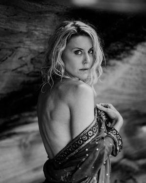 Artistic black and white portrait series showing dramatic poses against a moody textured background.
