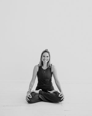 A sequence of four black and white photos showing a person in dark clothing sitting in different meditative poses.