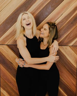 Candid lifestyle photos against wooden chevron wall showing natural interactions in black outfits.
