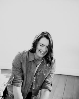 Black and white photo series captures candid moments during an energy healing session.