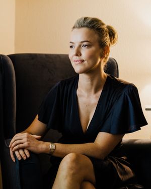A series of moody portraits showing a person in a black top against a warm-toned background.