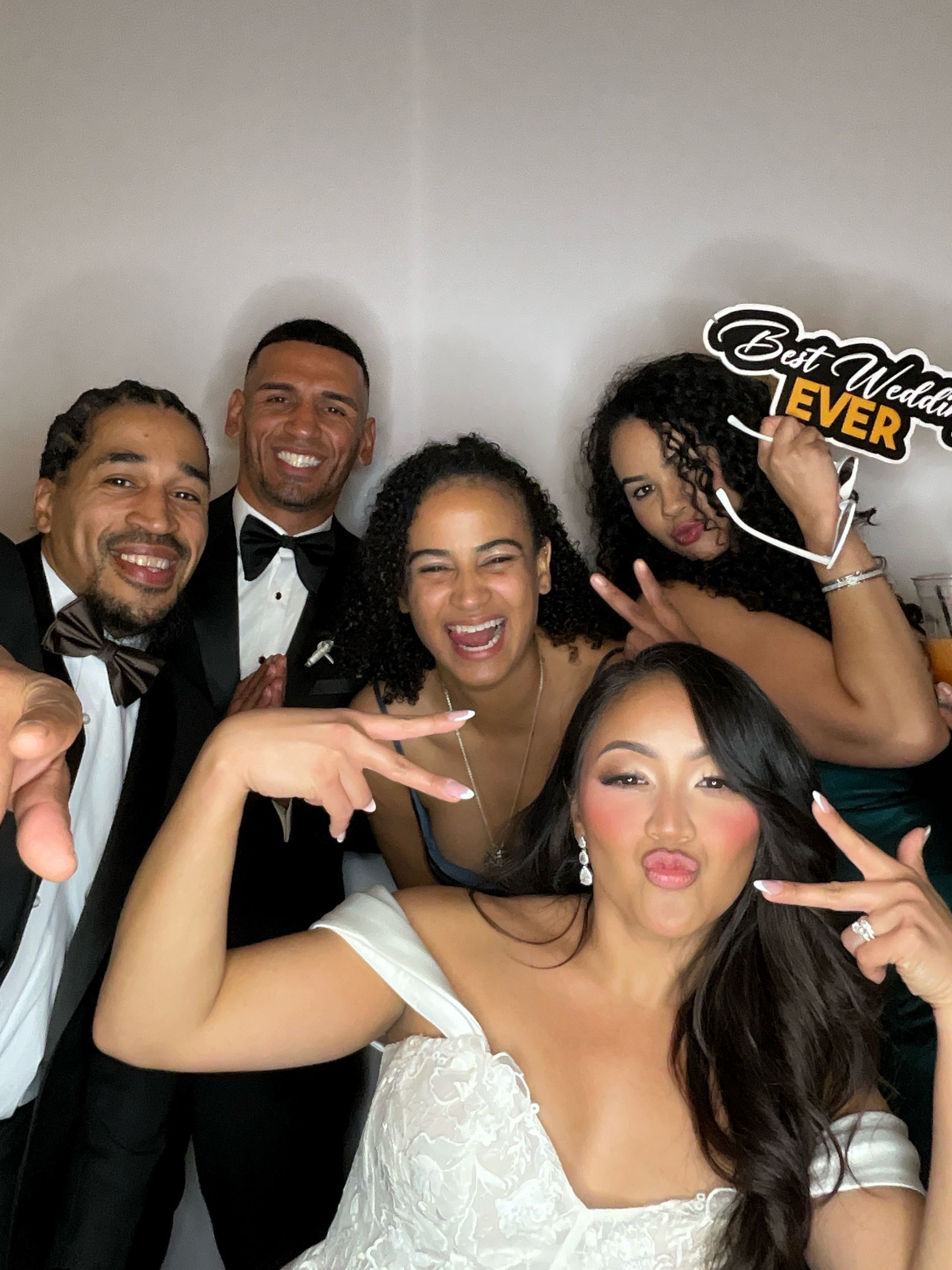 Group of friends posing together and making silly faces at a party or celebration event.
