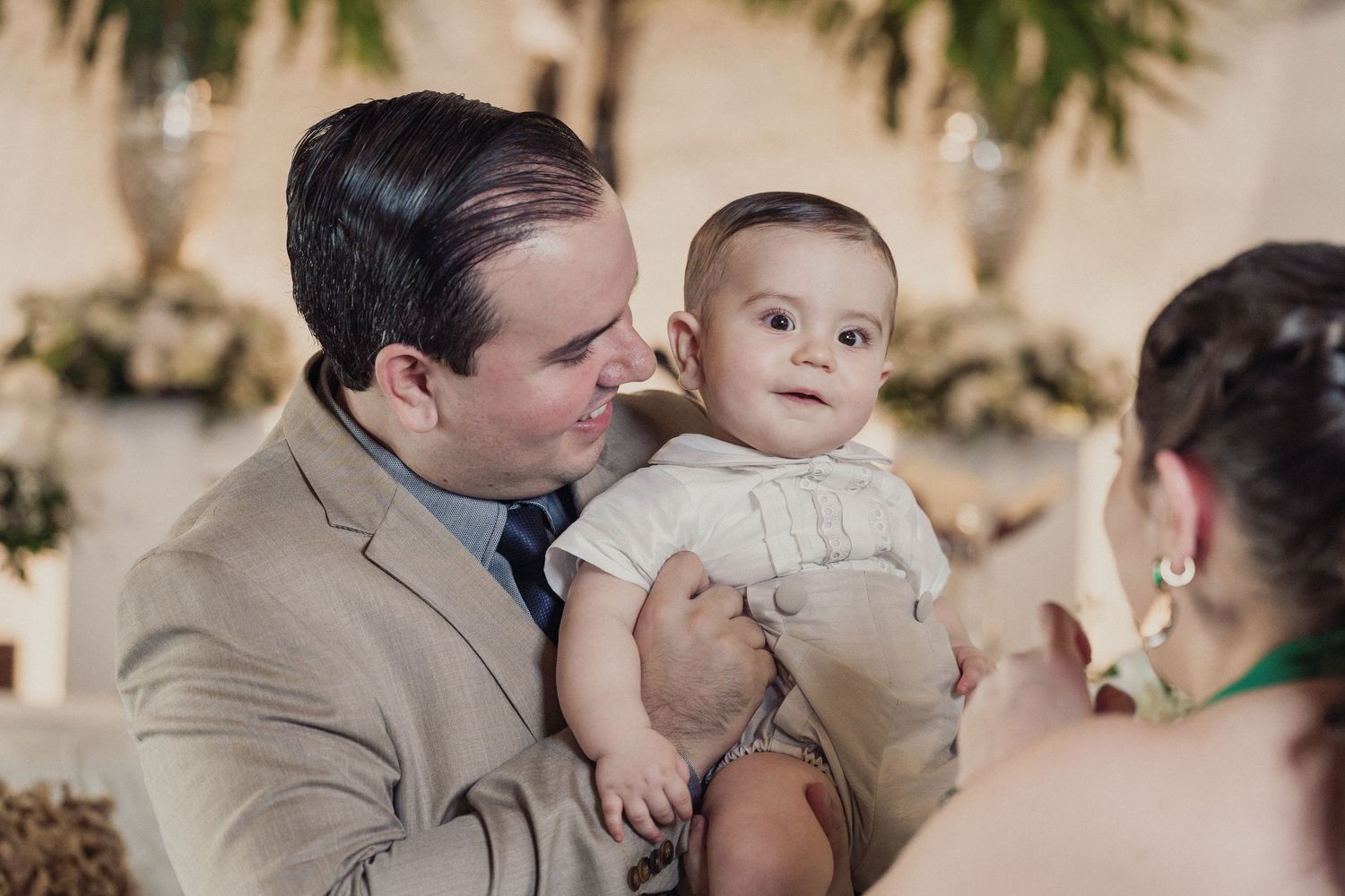 Wedding guests share an intimate moment during an emotional reception celebration.