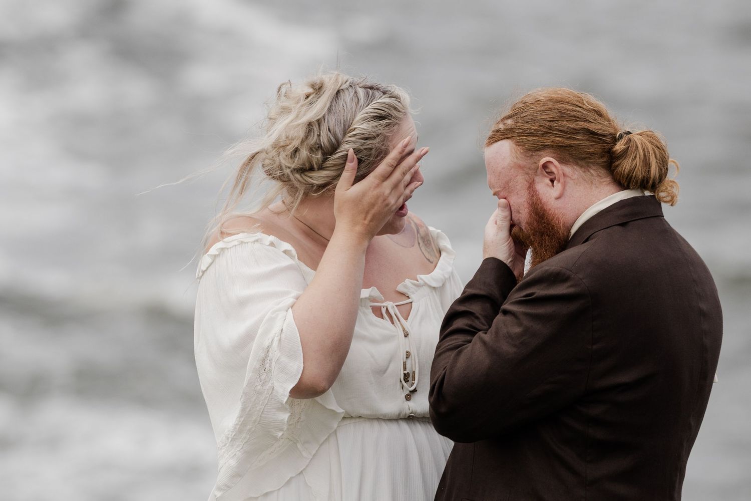 Couple sharing emotional vows during intimate elopement ceremony on Doolin Cliff Walk overlooking the Atlantic Ocean