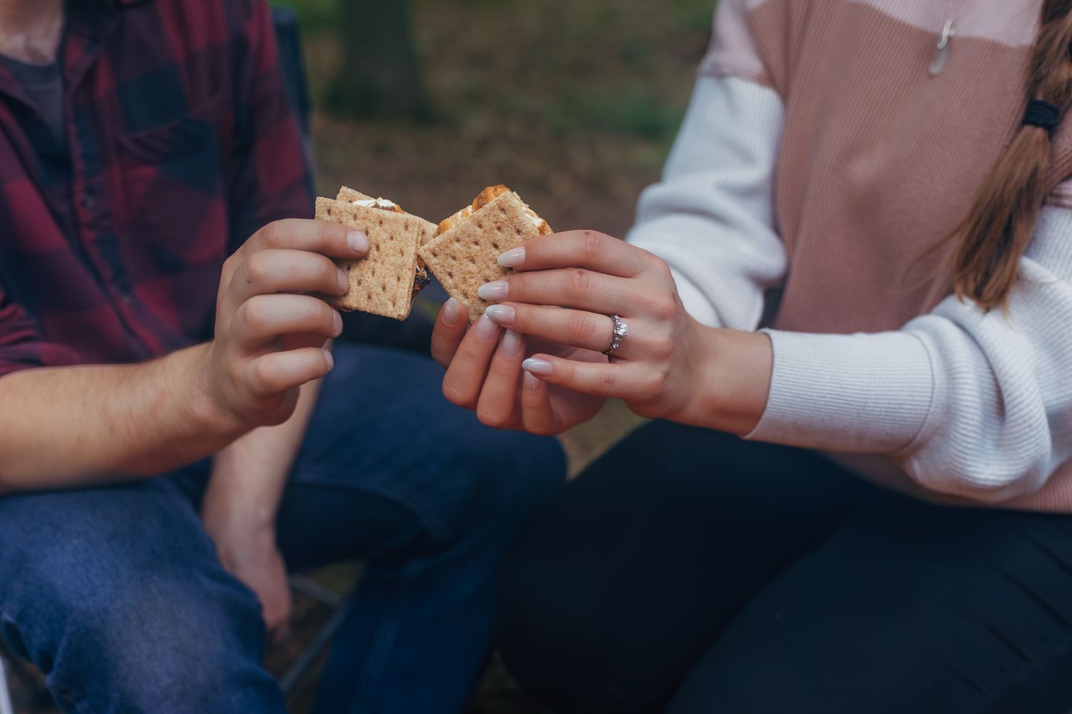 Detail photo of engagement ring and smores that were cooked during a relaxed and cozy engagement session in Wausau, Wisconsin