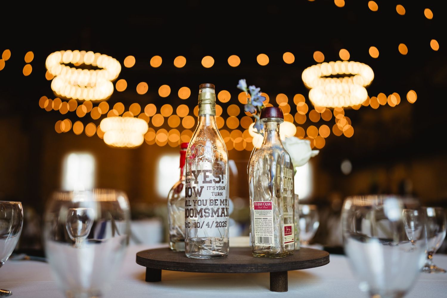 String lights and glowing lanterns create a warm ambiance at an evening wedding reception.