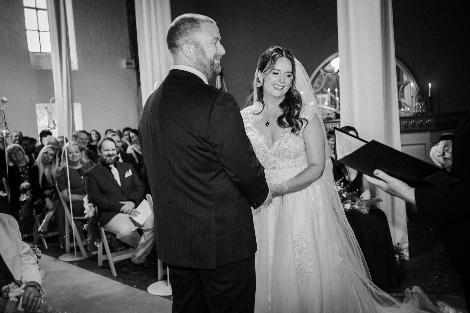 Black and white candid wedding ceremony photos showing intimate moments during the service.