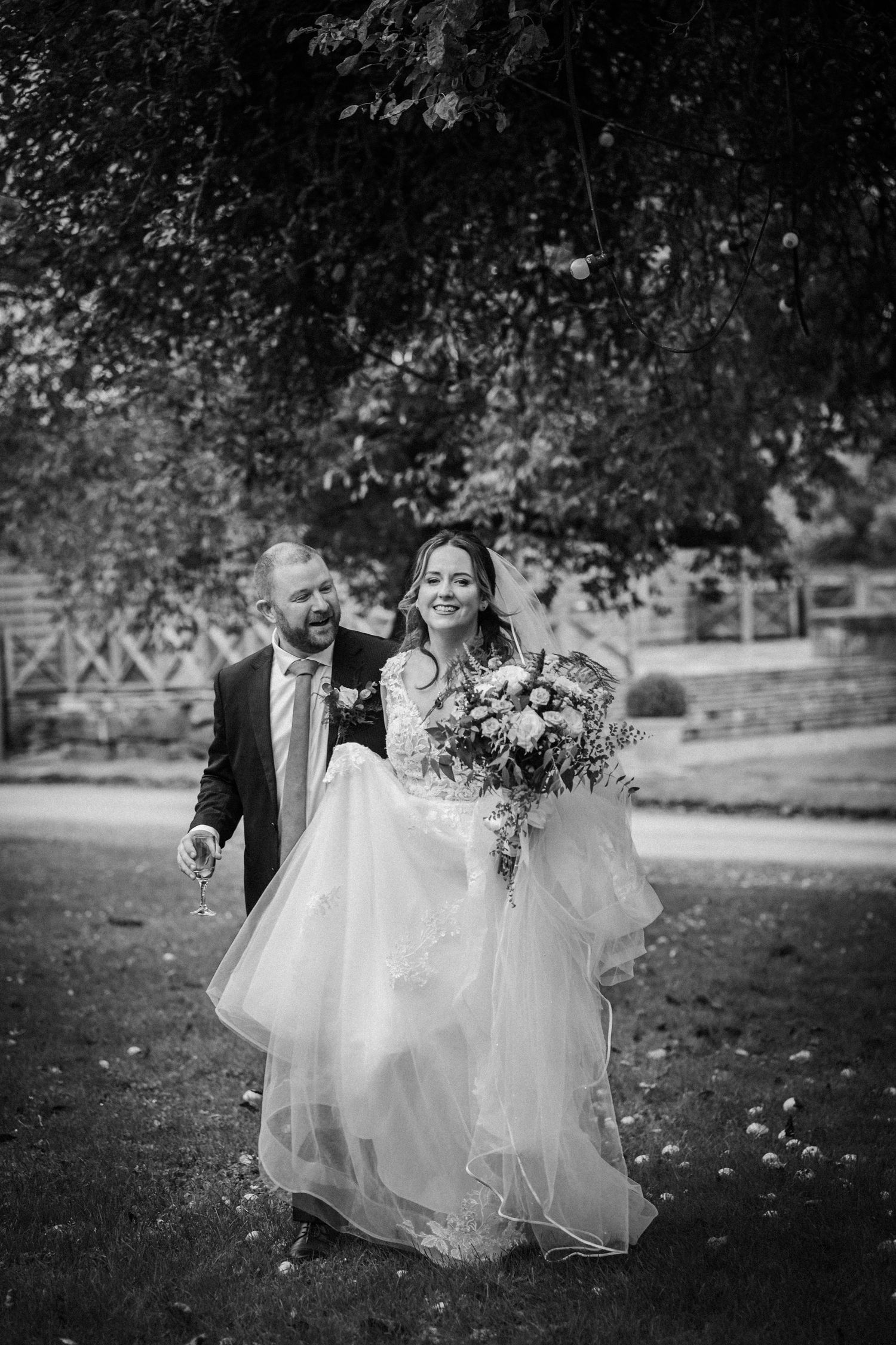Black and white series of joyful moments captured during an outdoor wedding celebration.