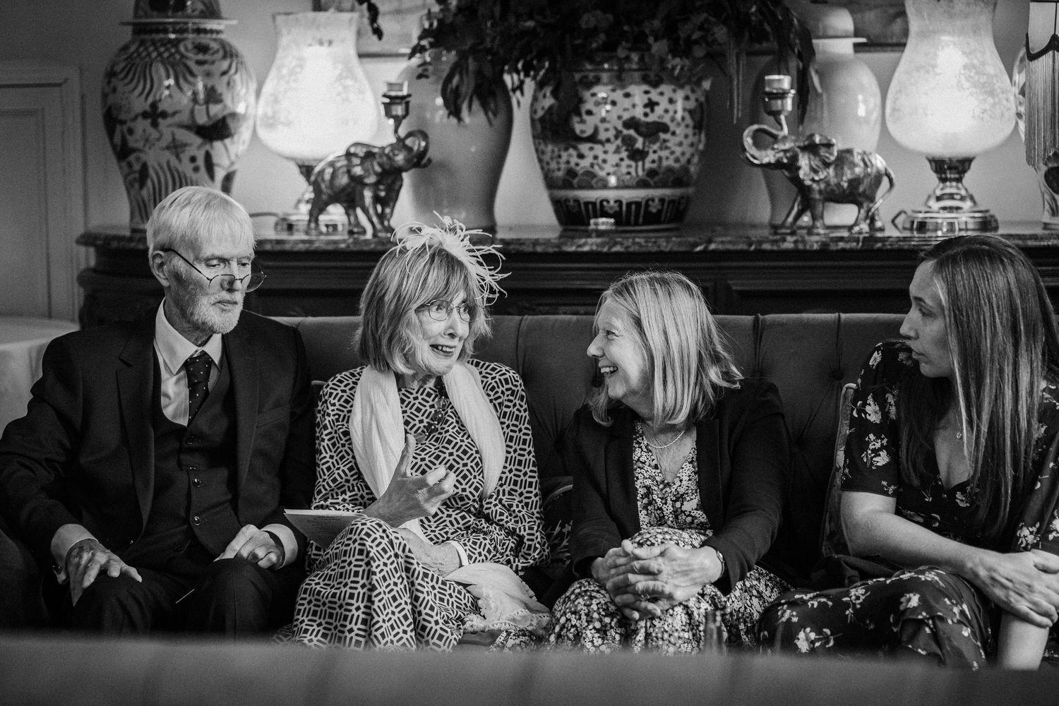 Candid black and white photographs showing people dining and socializing at a restaurant table.
