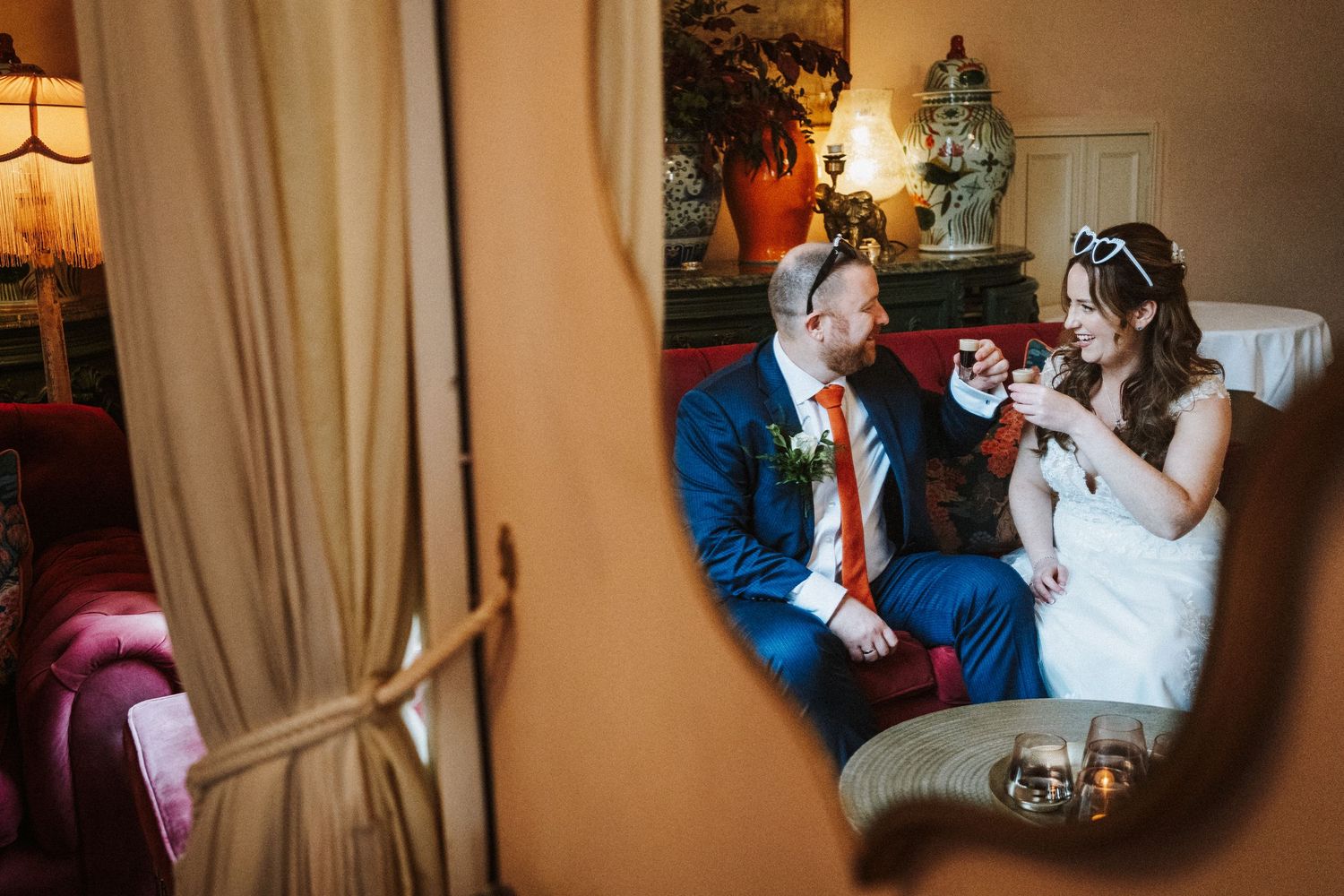 Wedding celebration candid moments captured in warm indoor lighting.