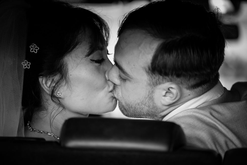 A romantic black and white photo collection showing intimate couples kissing and embracing in various settings.