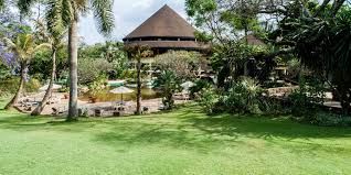 luxury garden wedding venue in Nairobi, captured by Nairobi Wedding Photographer, Bonnie Gichuru, showcasing lush greenery and flower arches
