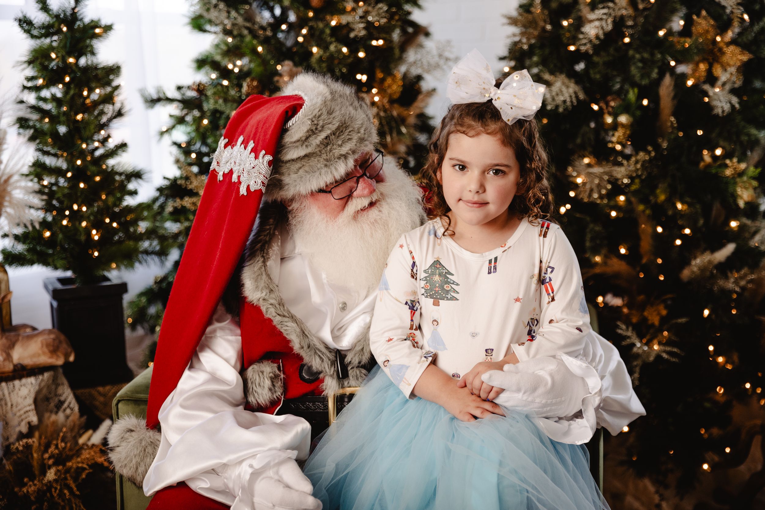 Professional Christmas photo of child with Santa at Urso Photography, Fort Oglethorpe, GA
Family portrait with Santa and Mrs. Claus during t