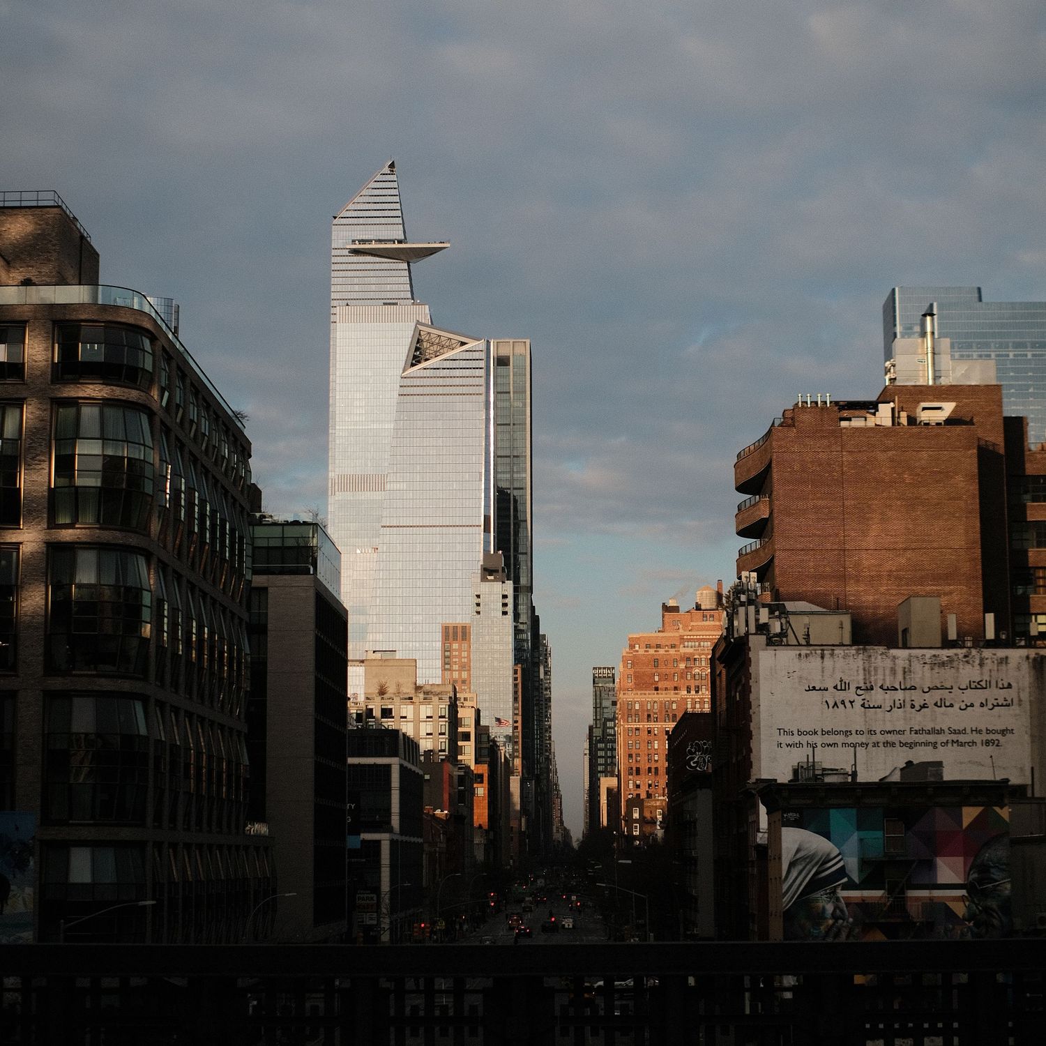 Urban skyline with mix of modern and historic buildings at sunset.