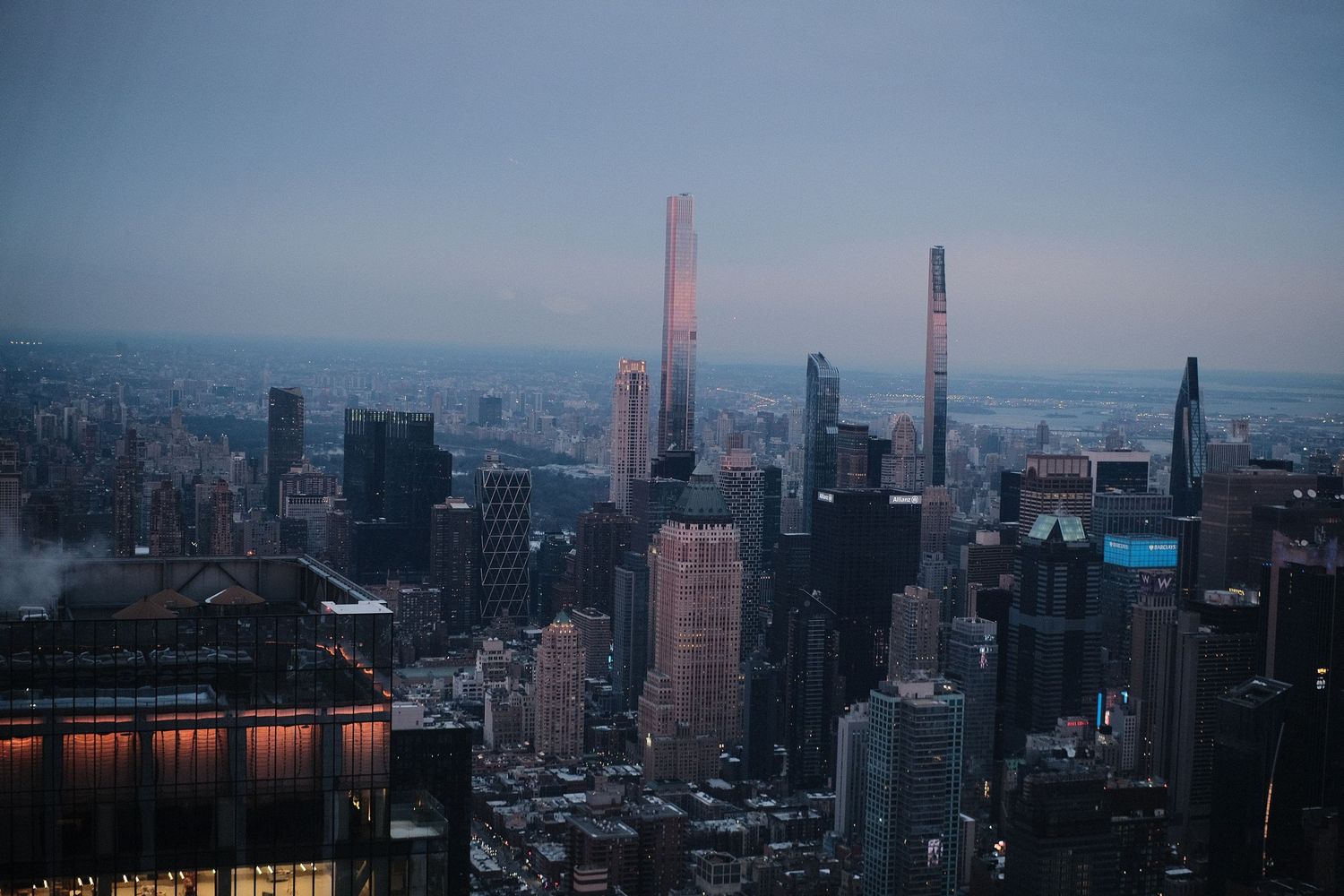 Wide panoramic view of Manhattan's urban skyline during twilight hours.