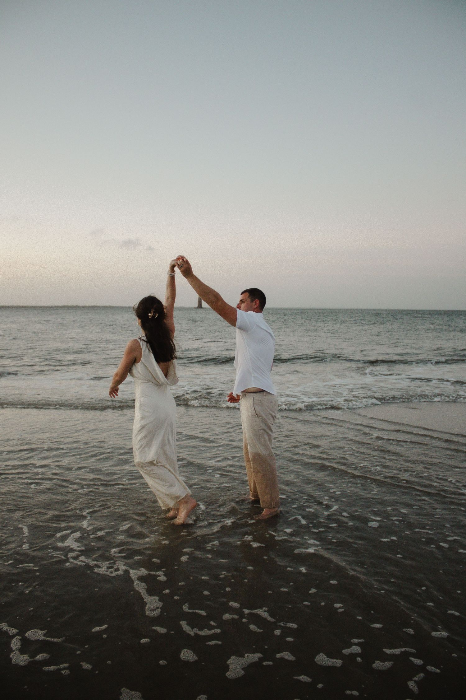 couples holding hands walking on beach, elopement, Cincinnati, northern Kentucky, travel photographer, beach elopement