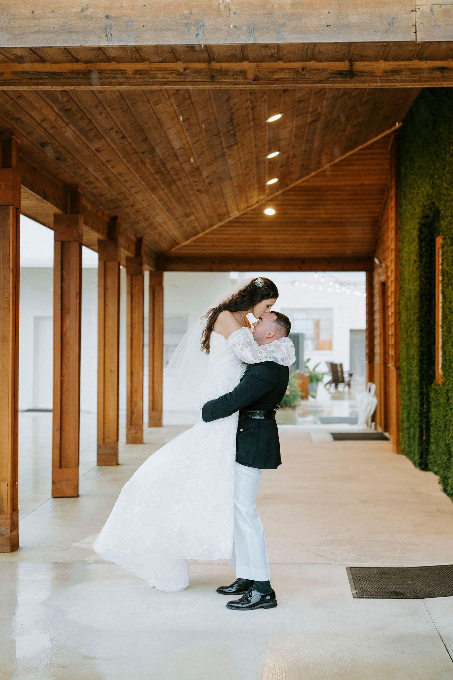 A romantic wedding sequence showing a couple in a white dress and suit dancing in an industrial-style venue.