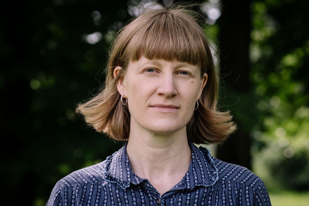 A series of headshots showing the same person in different expressions and angles outdoors with greenery in background.