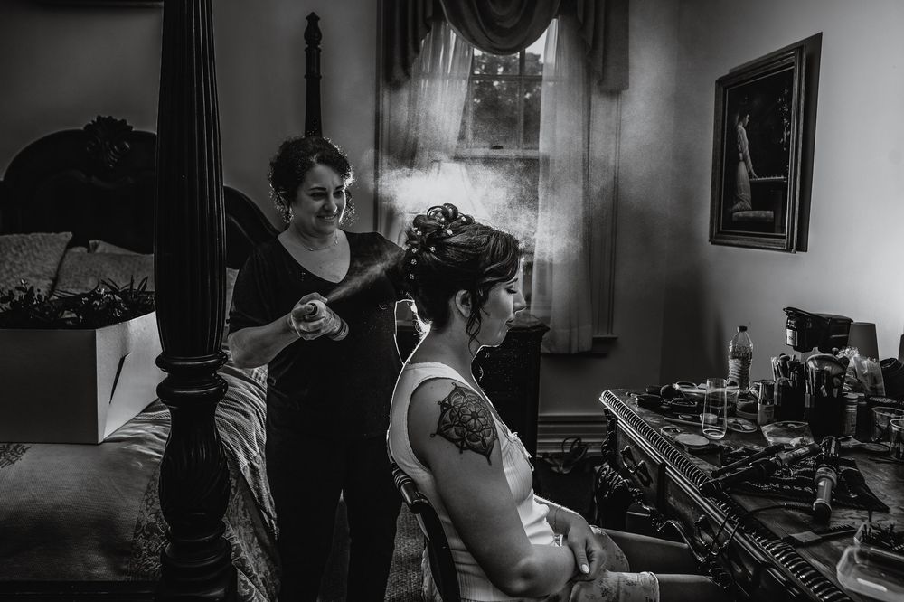 A dramatic black and white photo series showing musicians performing and recording in a dimly lit studio setting.
