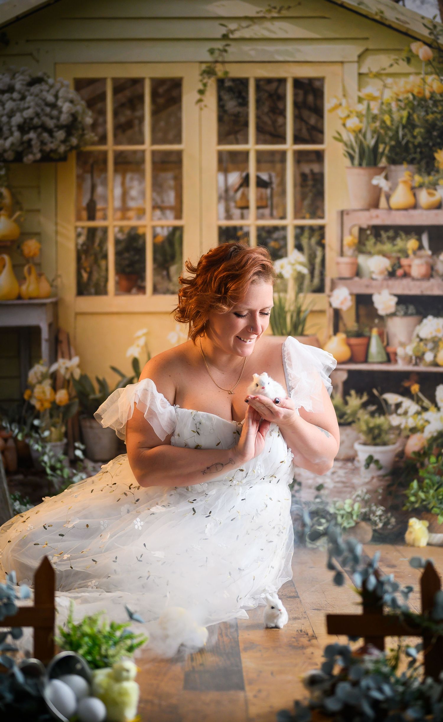 A sequence of artistic photos showing a person in a white dress leaping gracefully through the air in a garden setting.