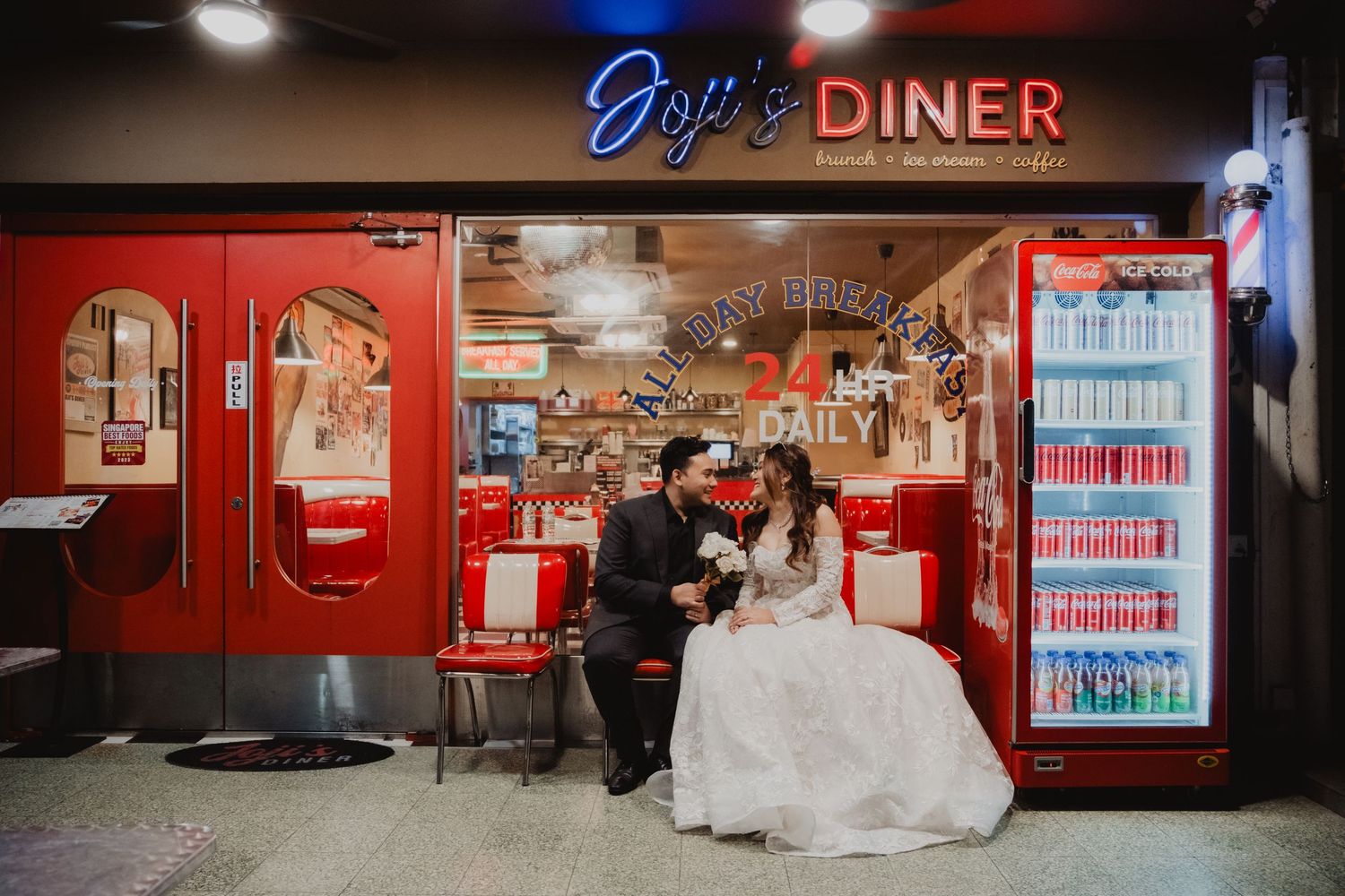 Interior shots of a retro-styled American diner with red booths and classic decor. Singapore
