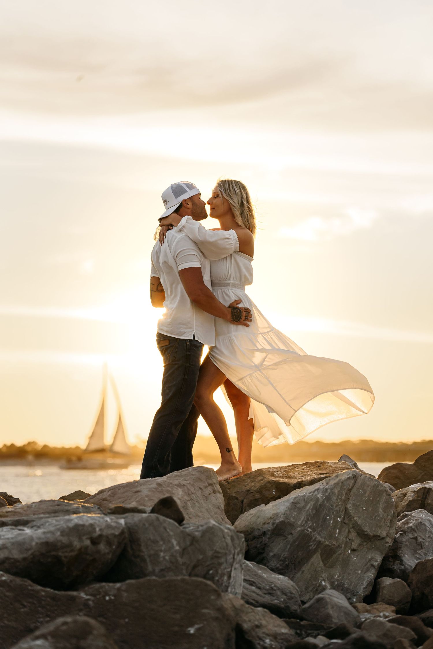 Best couples photographer near me in Destin Florida captures candid moments with couples during engagement at the best place for sunsets.