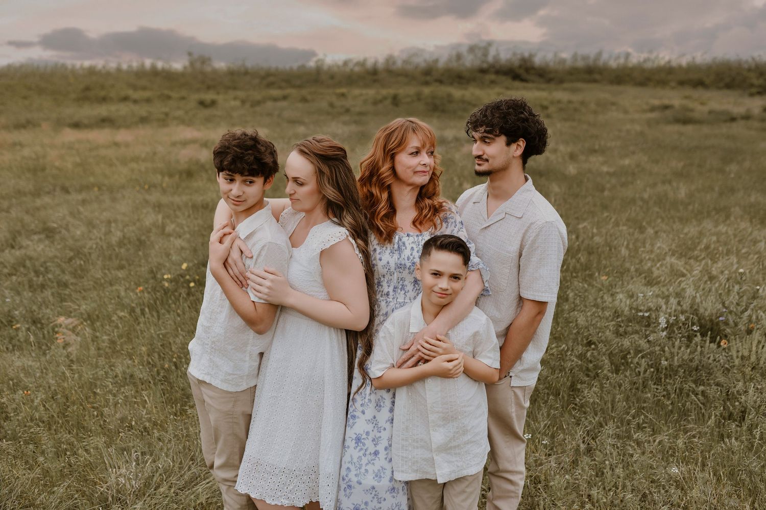 Multi-generational family portrait featuring grandparents and young grandchildren