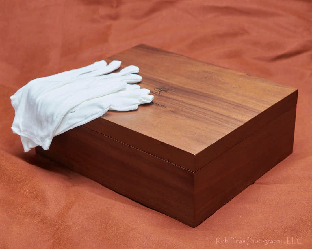 8x10 premium walnut olio box .  Shown with white gloves on top of box.