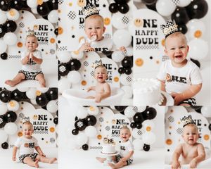 Black and white “One Happy Dude” cake smash collage with modern balloon backdrop and baby boy first birthday portraits.