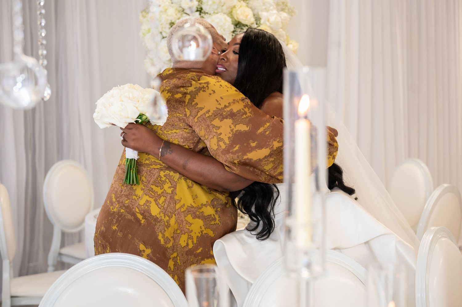 An emotional hug, photographed by Palm Beach wedding photographers.