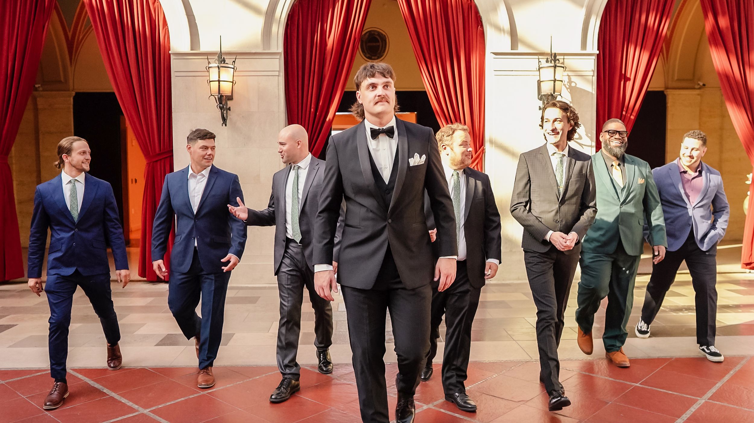 groomsmen posing in Columbus Museum Of Art