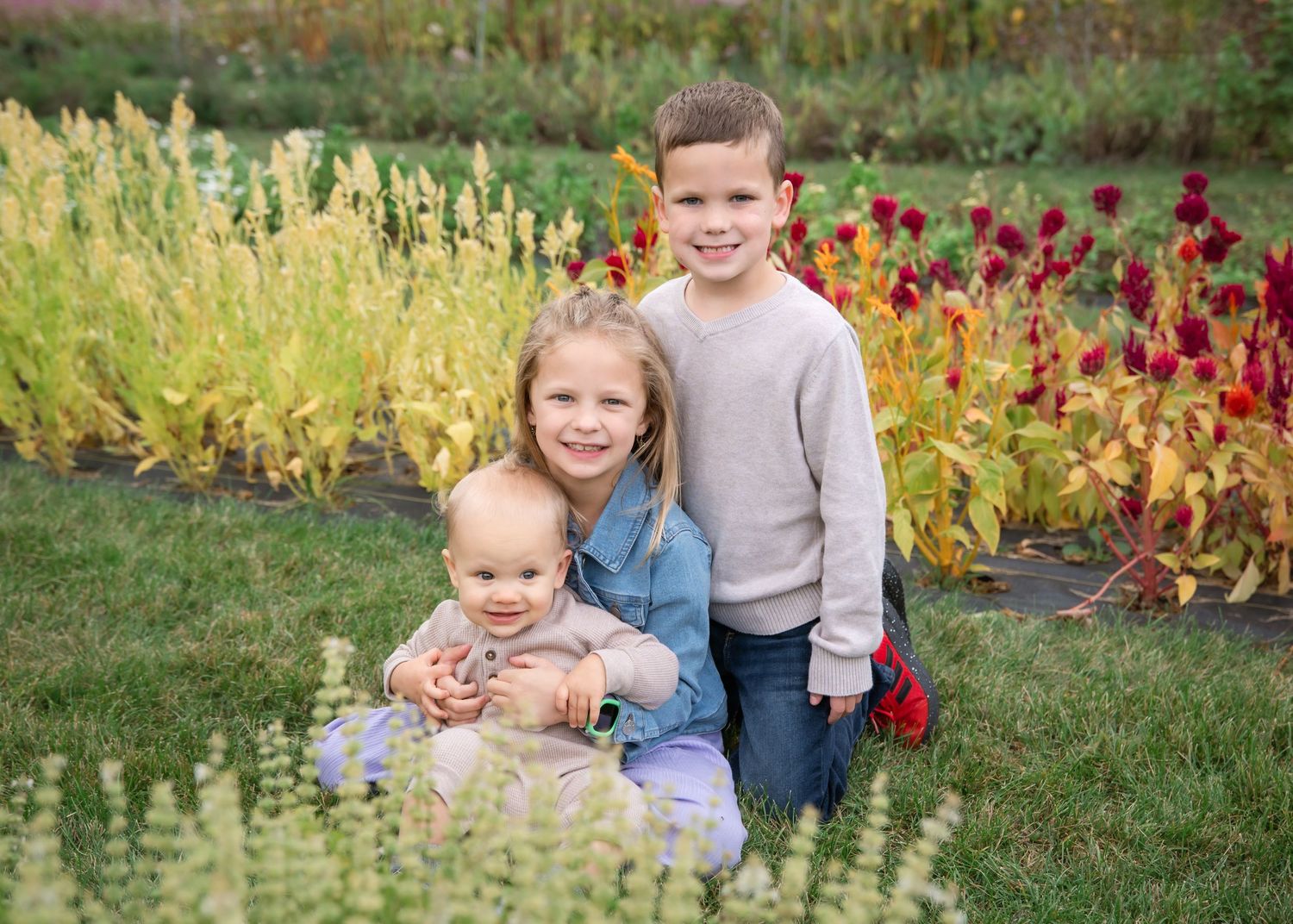 A collage of outdoor autumn portraits showing people sitting and standing among colorful fall foliage and flowers.