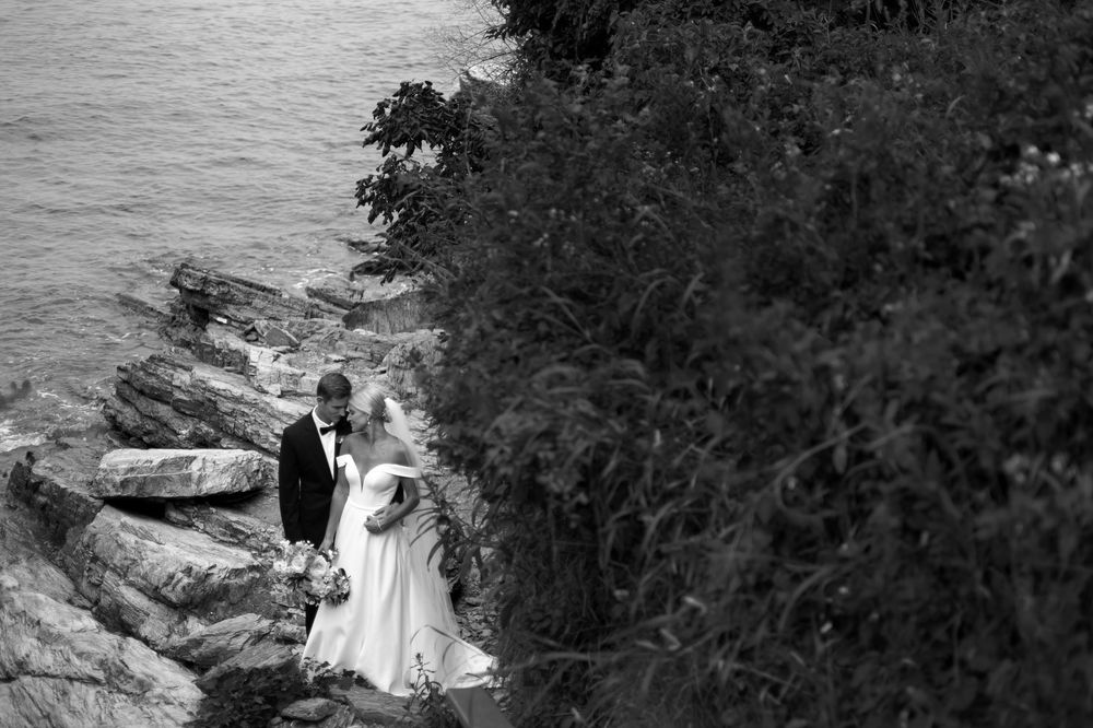 A romantic black and white wedding photo sequence shows a couple embracing in an outdoor garden setting.