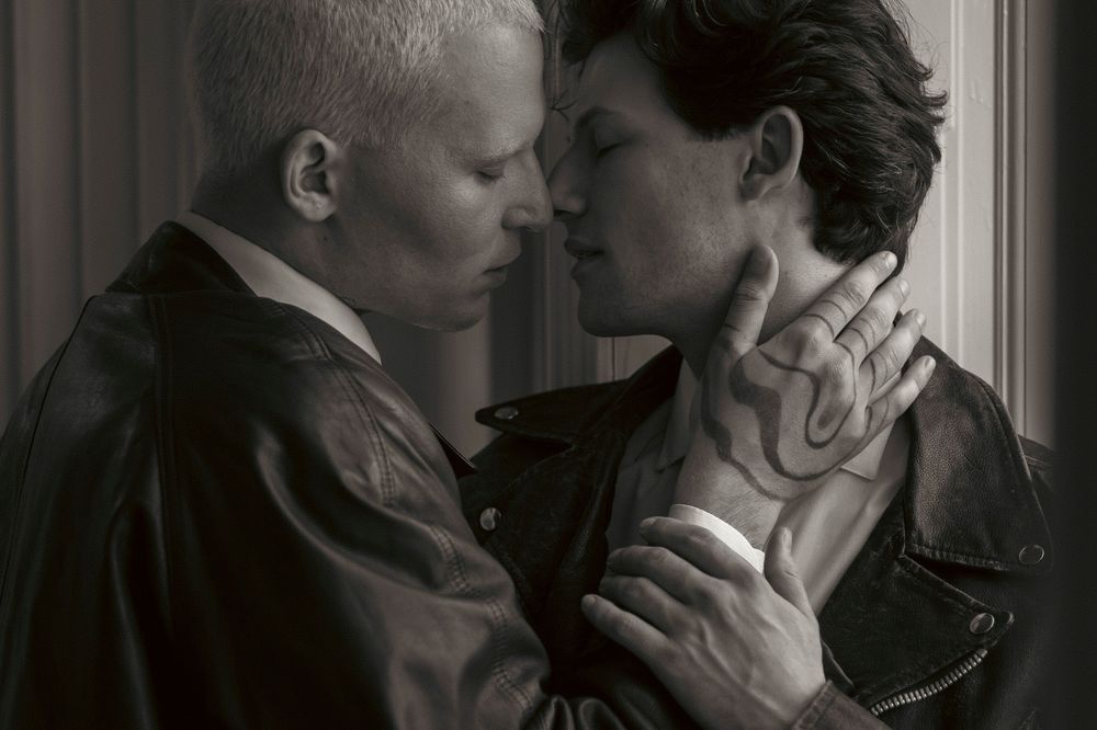 A black and white photo series showing four romantic couples embracing and sharing intimate moments together.