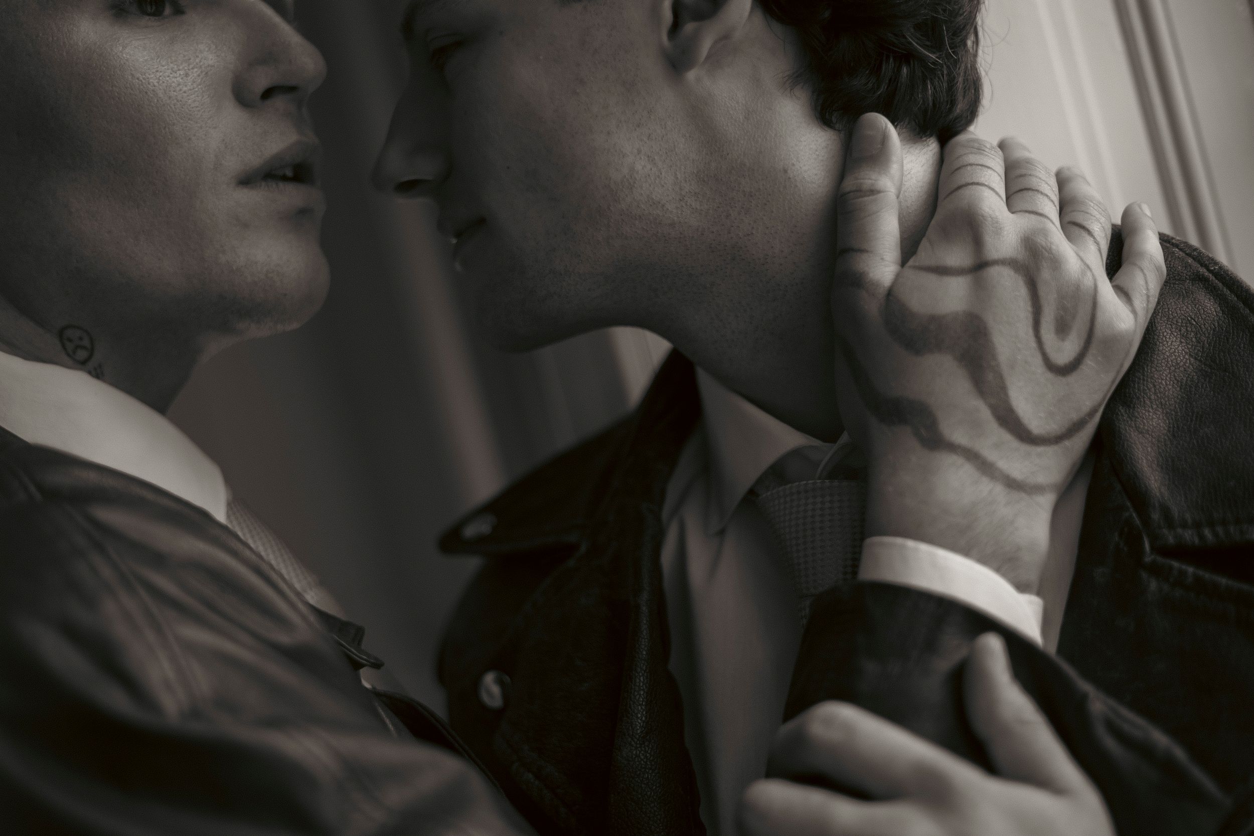 Black and white photo series showing emotional expressions and gestures in dramatic lighting.