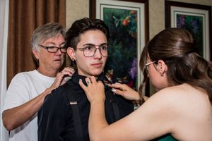 Candid moments captured during an indoor wedding reception celebration.