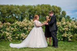 Outdoor wedding ceremony photos with lush greenery and natural scenery.