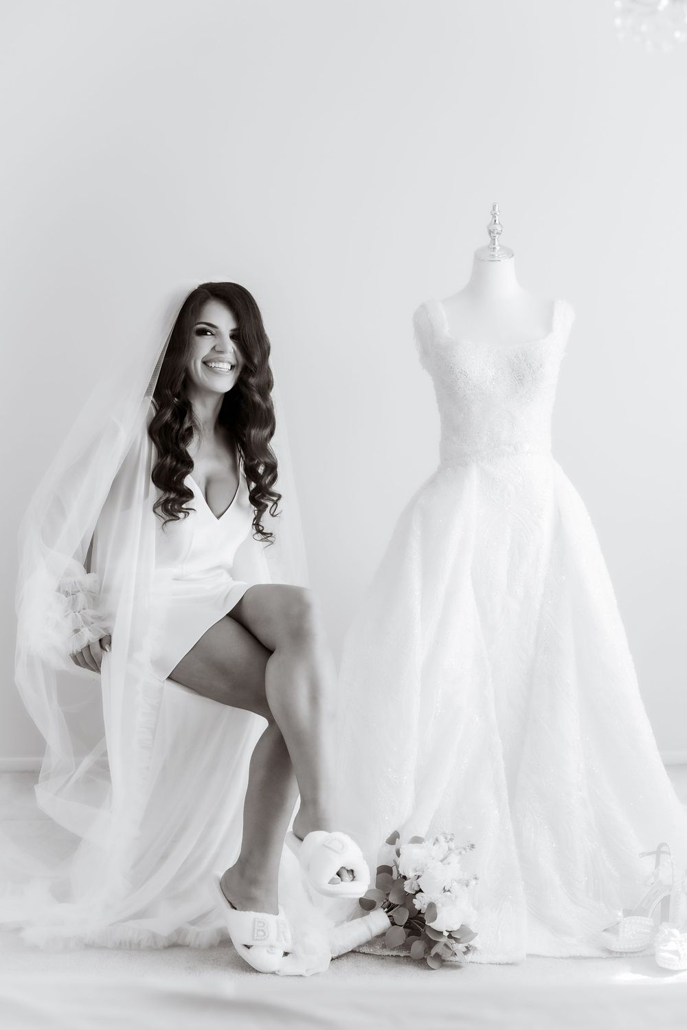 Four artistic black and white bridal boudoir photos featuring elegant poses with wedding gowns and mannequins.