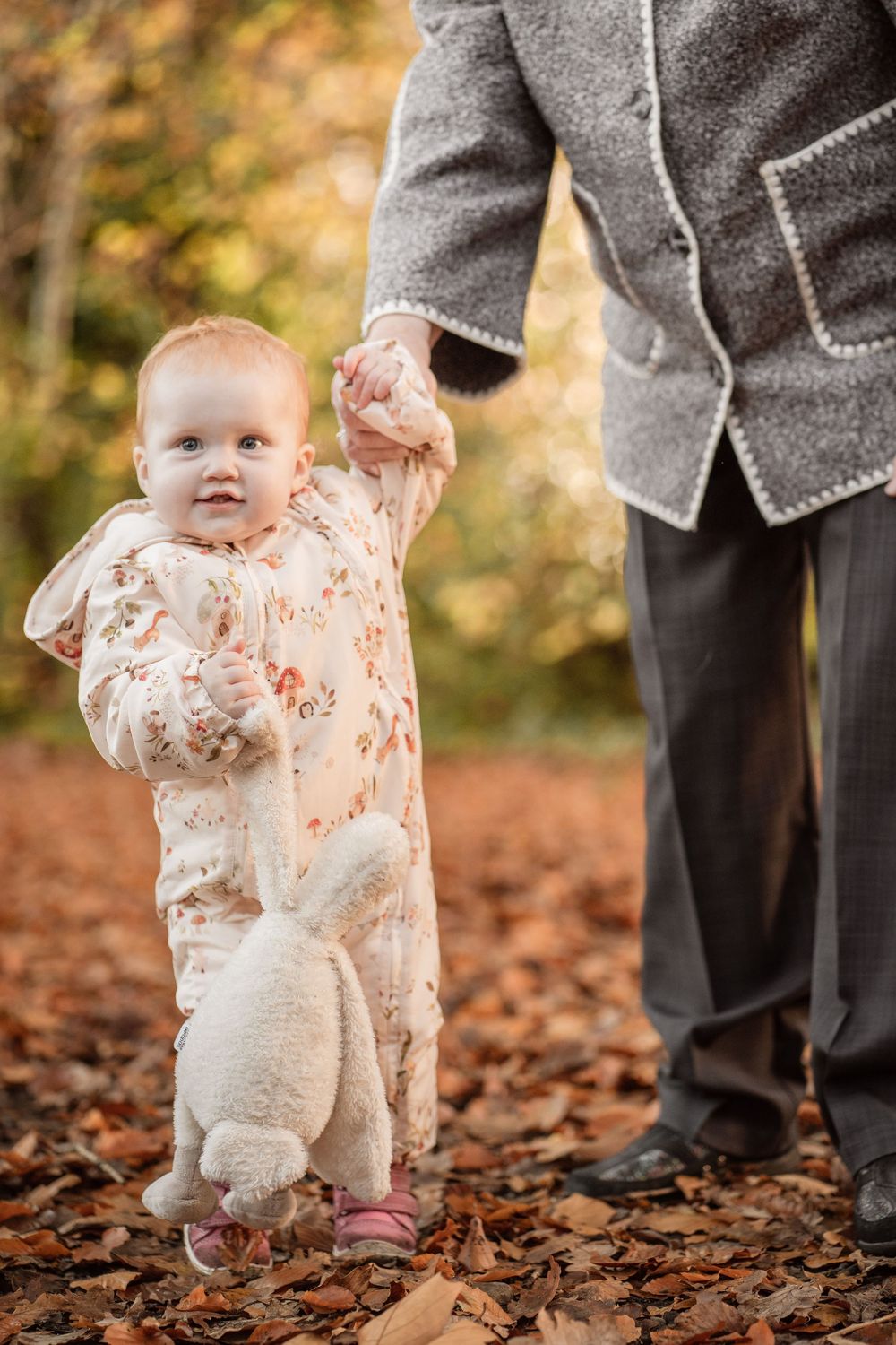 A series of photos showing small feet walking through autumn leaves with adult guidance.